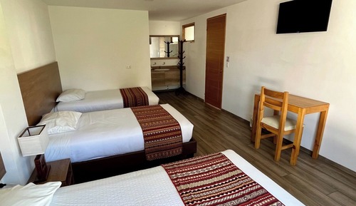 Habitación triple familiar, varias camas