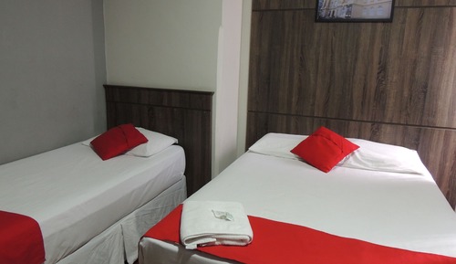 Habitación triple, varias camas