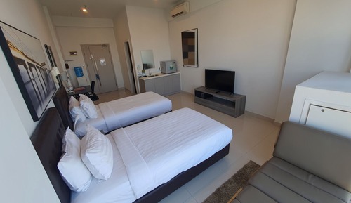 Habitación superior con 2 camas individuales, vistas a la ciudad