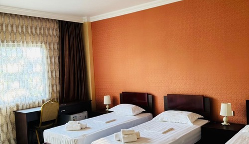Habitación triple Deluxe, varias camas