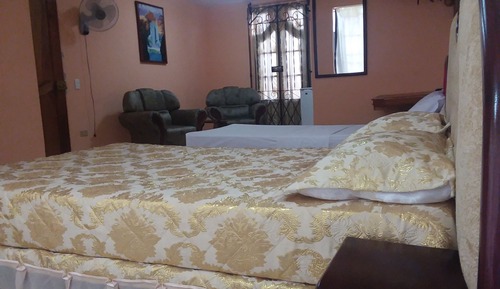 Habitación triple Deluxe, varias camas