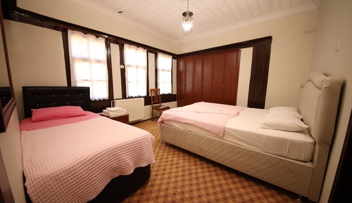 Habitación triple familiar, vistas al jardín