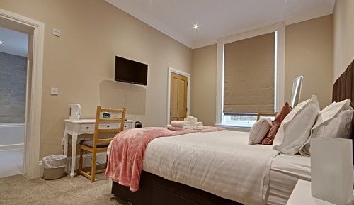 Habitación Deluxe con 1 cama doble o 2 individuales, baño privado
