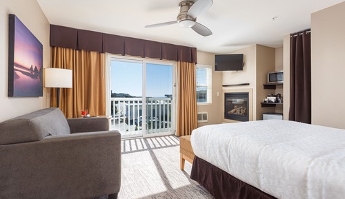 Habitación Deluxe, 1 cama de matrimonio, chimenea, vistas parciales al mar