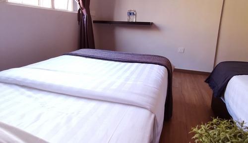 Habitación triple Deluxe, varias camas