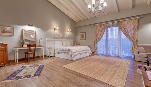 Suite with Fireplace & Forest View