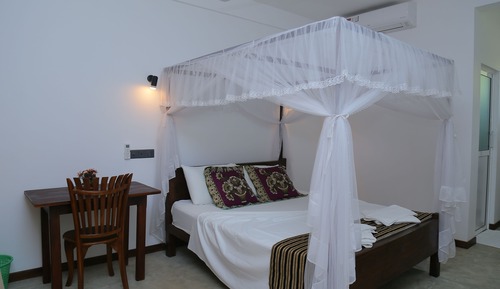 Habitación triple Deluxe, varias camas, no fumadores, vistas al jardín