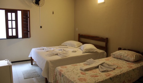 Habitación triple, varias camas
