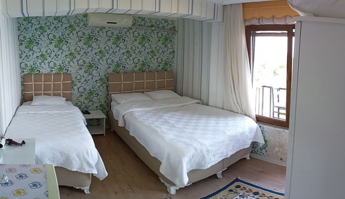 Habitación triple, vistas al mar