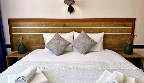 Habitación triple, vistas al mar