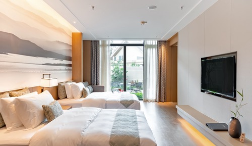 Habitación familiar con 2 camas individuales, en la zona del jardín