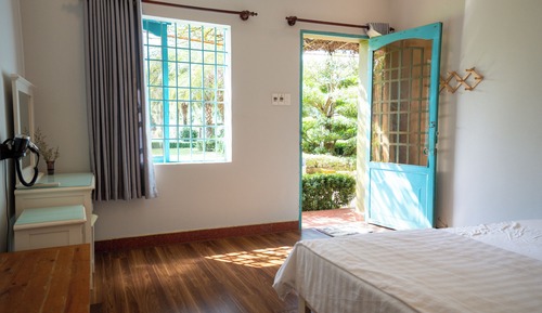 Habitación Deluxe doble, vistas al jardín, en la zona del patio