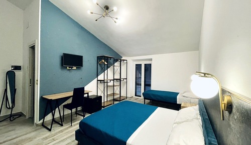 Habitación familiar con 1 cama doble o 2 individuales, vistas a la ciudad