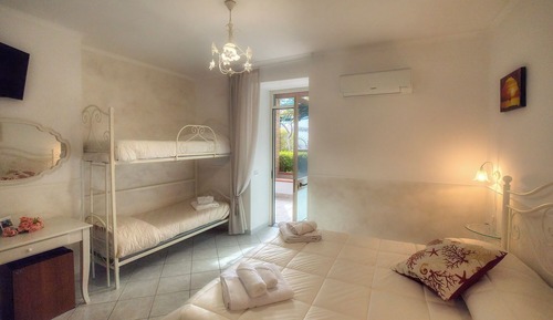 Habitación cuádruple familiar, vistas al jardín