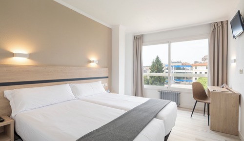 Habitación estándar con 1 cama doble o 2 individuales