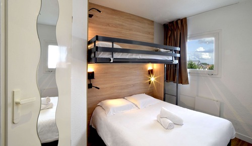 Habitación triple, varias camas