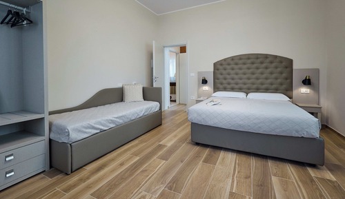 Habitación cuádruple Deluxe, varias camas