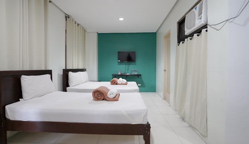 Habitación familiar, varias camas, vistas a la ciudad