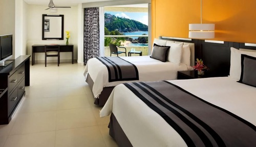 Habitación Deluxe, 2 camas dobles, vistas parciales al mar
