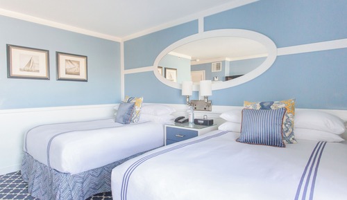 Room with Two Double Beds and Partial Ocean View