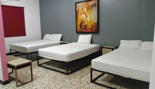 Habitación triple familiar, varias camas