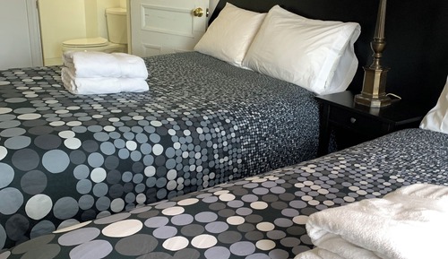 Habitación Deluxe con 1 cama doble o 2 individuales, baño privado