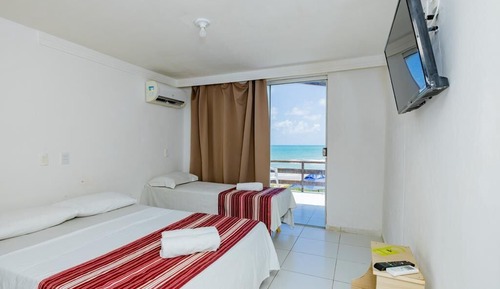 Habitación triple, vistas al mar