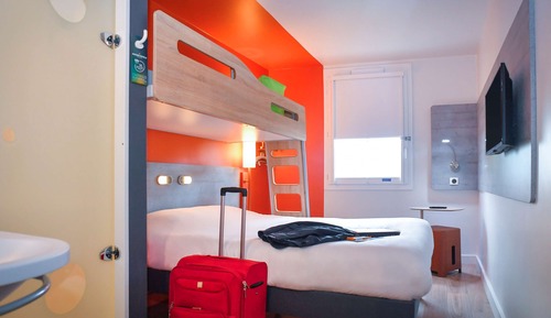 Habitación triple, varias camas
