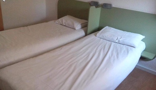 Habitación triple, varias camas