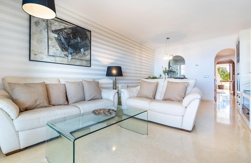 Rincon de la Victoria Apartamento | Comfortable, attractively located vacation home with shared pool and panoramic sea views.