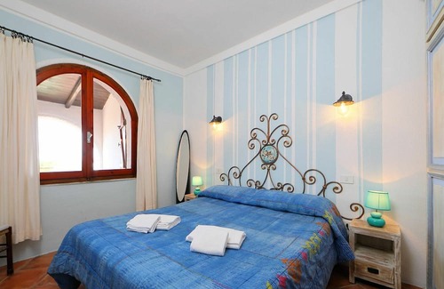 Trinita d'Agultu e Vignola Apartamento | Nice apartment for 5 guests with TV, terrace and pets allowed