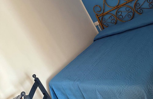 San Vincenzo Villa | 2 bedrooms with double beds, bathroom and patio serving the rooms.