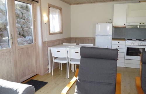 Spangereid Casa | Holiday home "Ramsland Brygge 5", on the fjord Ramslandsvågen near Ramsland, Spangereid-Lindesnes, southern Norway, max 4 adults child, 2 bedrooms, 1 bathroom, boat mooring at the jetty in front of the house, terrace at the house, final cleaning .