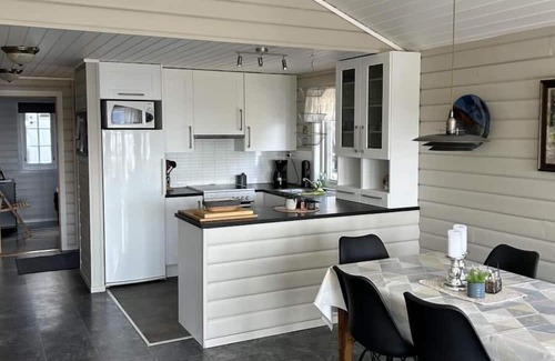 Lindesnes Casa | Holiday home Mona in Lussevika, new addition 2024, near Spangereid-Lindesnes, southern Norway, , max. 6 adults, own boat mooring, approx. 100 m² living space, 3 bedrooms, charming and tasteful furnishings, large veranda with fjord view, terrace f.