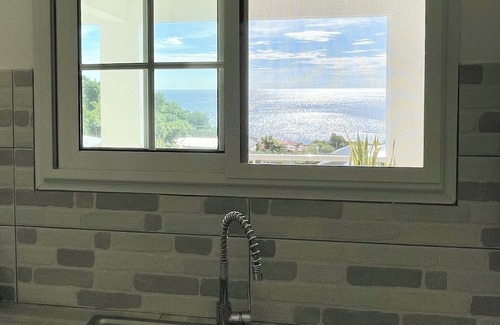 Les Anses-d'Arlets Apartamento | "Sweet bamboo" bottom of villa, sea view, 2 minutes from the beach