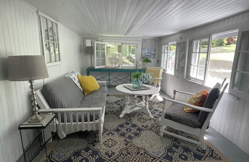 Greene Cabaña | Rustic cottage surrounded by trees, overlooking a creek.