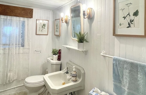 Greene Cabaña | Rustic cottage surrounded by trees, overlooking a creek.