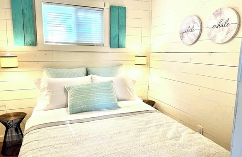 Whitewater Region Cabaña | The Little Blue Beach House waterfront with shallow and sandy beach dog friendly