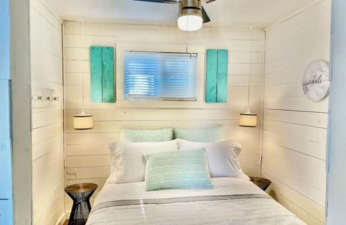 Whitewater Region Cabaña | The Little Blue Beach House waterfront with shallow and sandy beach dog friendly