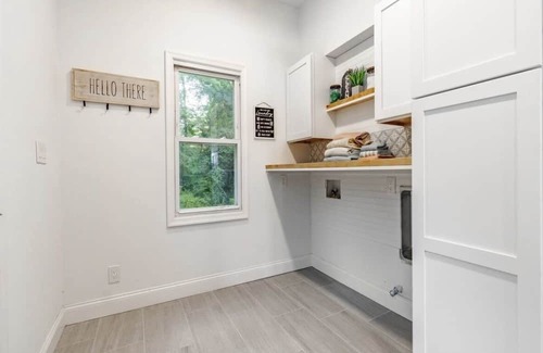 Mickleton Casa | Embrace the charm of our creekside haven featuring 4BR 3BA yoga and BBQ deck.