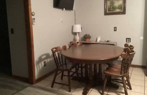 Onekama Apartamento | Relax on deck next to the pool in this two room suite.