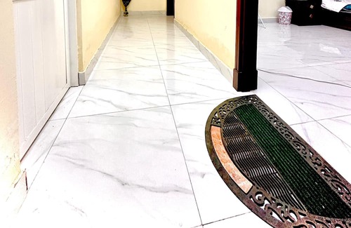 Seeb Apartamento | Bedroom with an attached bathroom, shared kitchen in area with everything around