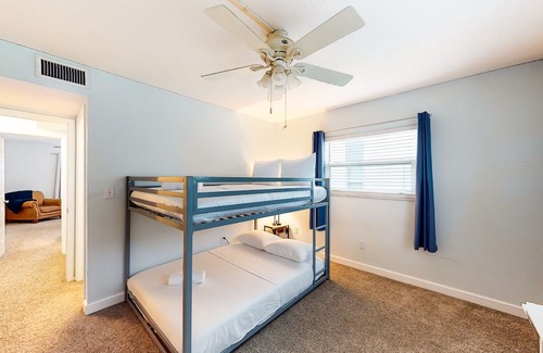 Capri Isle Casa | Renovated, waterfront townhome with pool & dock - walk to the beach