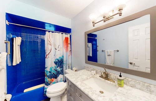 Capri Isle Casa | Renovated, waterfront townhome with pool & dock - walk to the beach