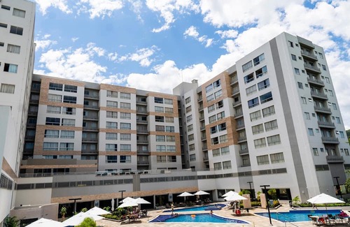 Pousada do Rio Quente Apartamento | Resort Park Veredas with the warm river in the background