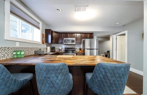 St. Albert Casa | Beautiful walkout basement suite with floor to ceiling windows and a great view