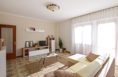 Lamon Apartamento | Look forward to a wonderful view of the countryside in this vacation apartment.