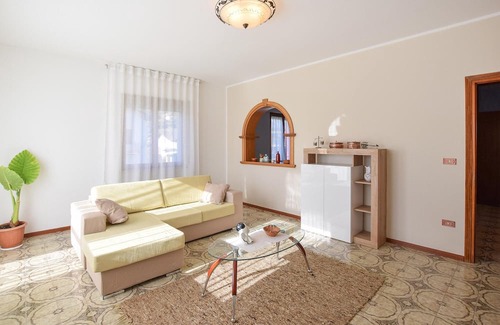 Lamon Apartamento | Look forward to a wonderful view of the countryside in this vacation apartment.