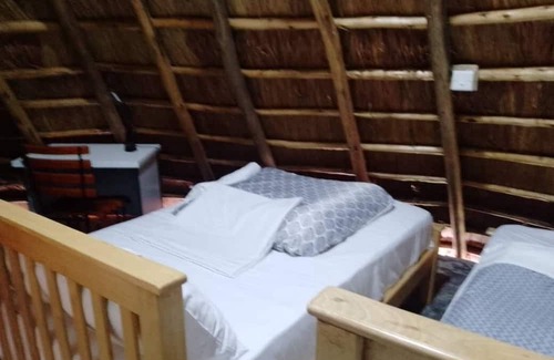 Western Region Otro | White Cat Farm Hut Inn is nestled on the outskirts of a quaint African village