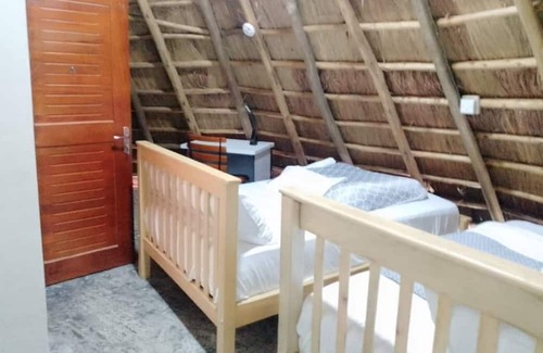 Western Region Otro | White Cat Farm Hut Inn is nestled on the outskirts of a quaint African village